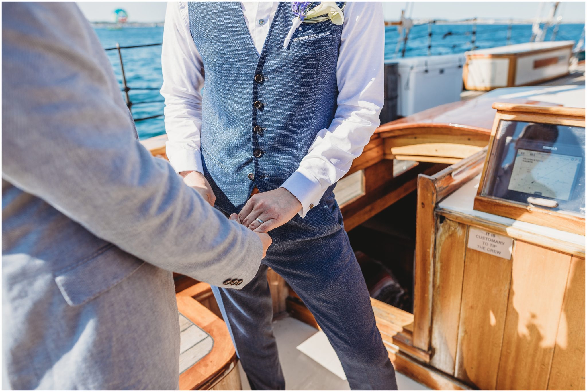 grooms holding hands - boston boat photography