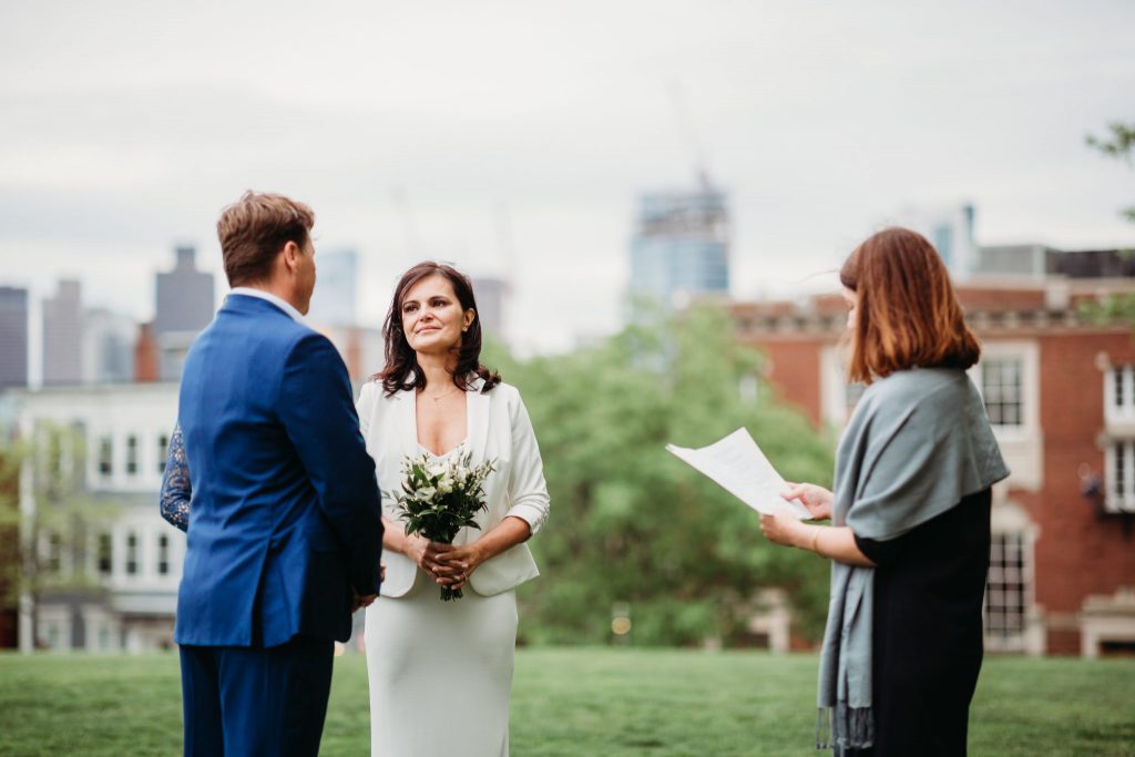 bride and groom exchange vows outdoors in boston