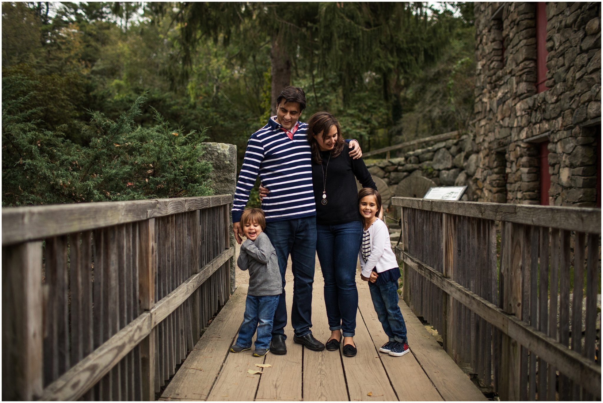 family of four on bridge by old mill - sudbury photographer