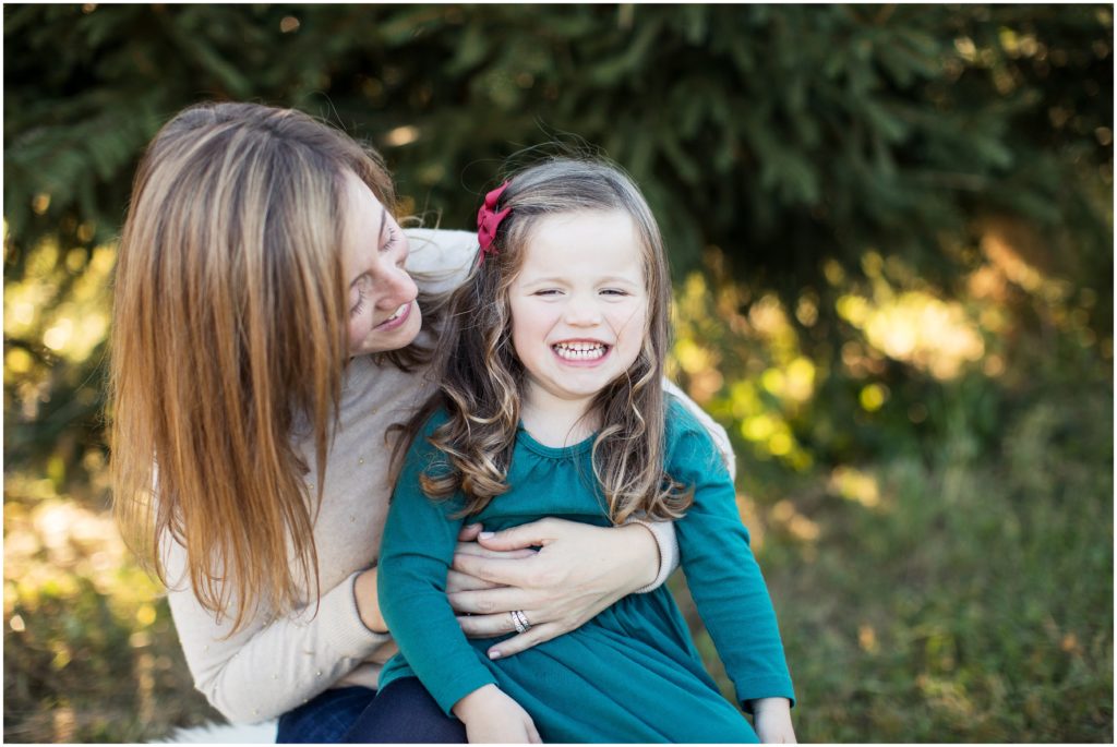 mom hugging daughter in green | boston child photographer