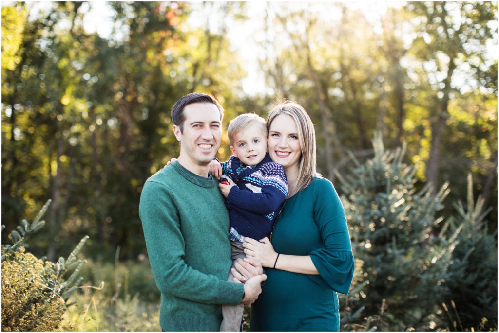 family of three by christmas trees | natick family photographer