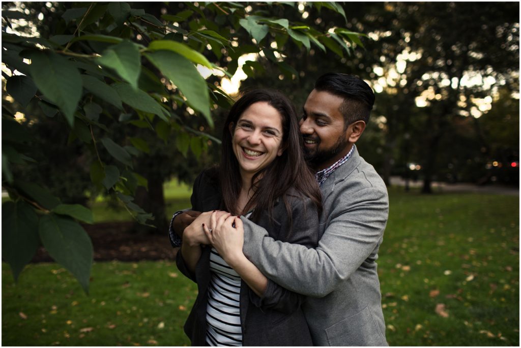 man hugging woman from the back - boston engagement photography