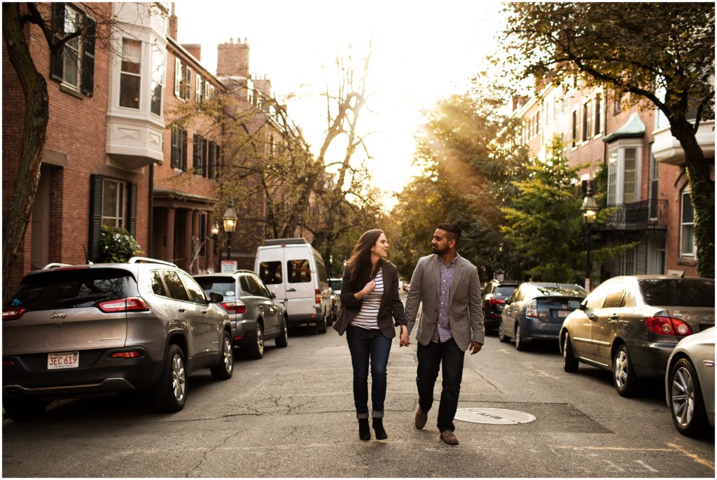 couple holding hands in city street - massachusetts wedding photographer