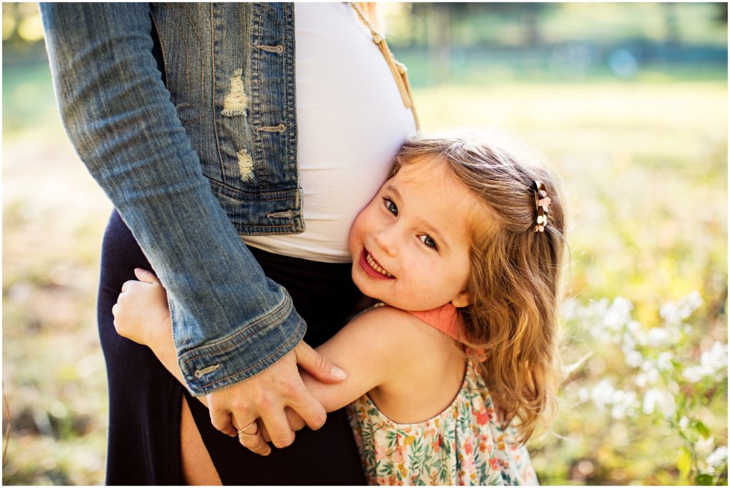 little girl hugging mom's belly - ma maternity portraits