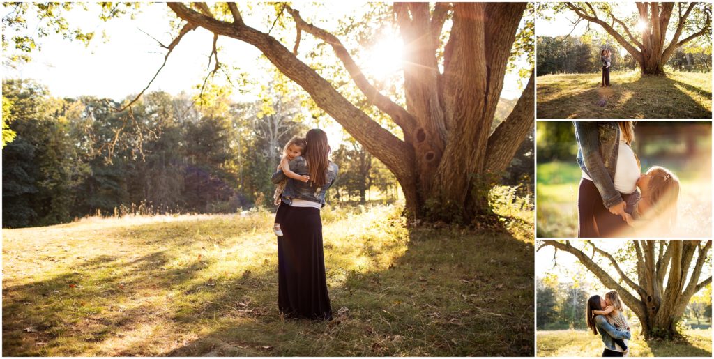 mother holding daughter by tree - lincoln family photographer
