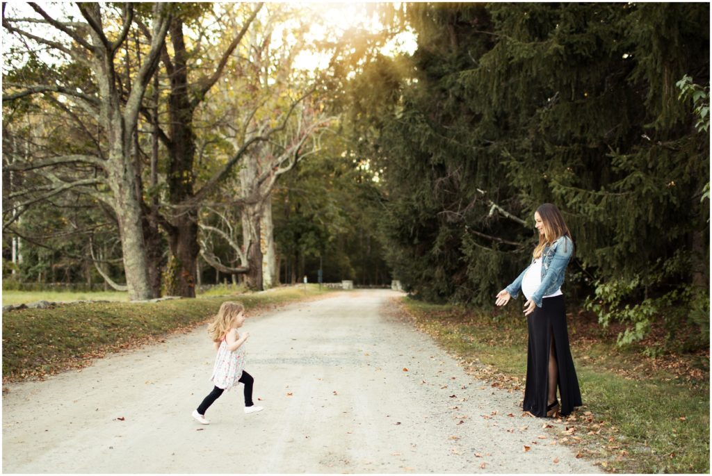 daughter running across road to mother - framingham maternity photographer