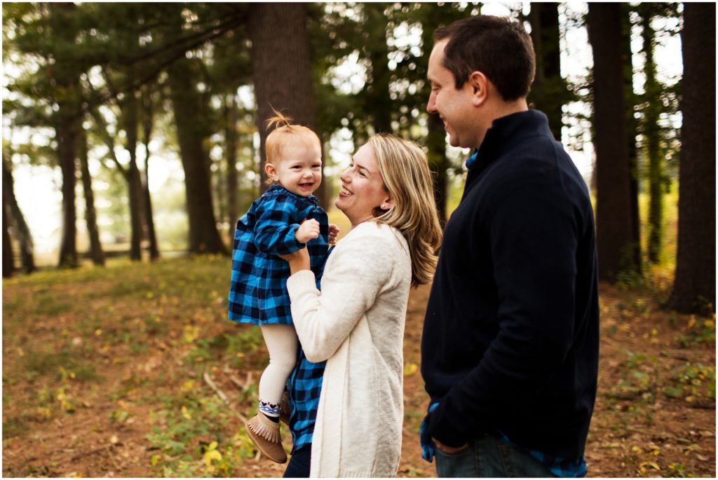 little girl laughing with parents- boston family photographer