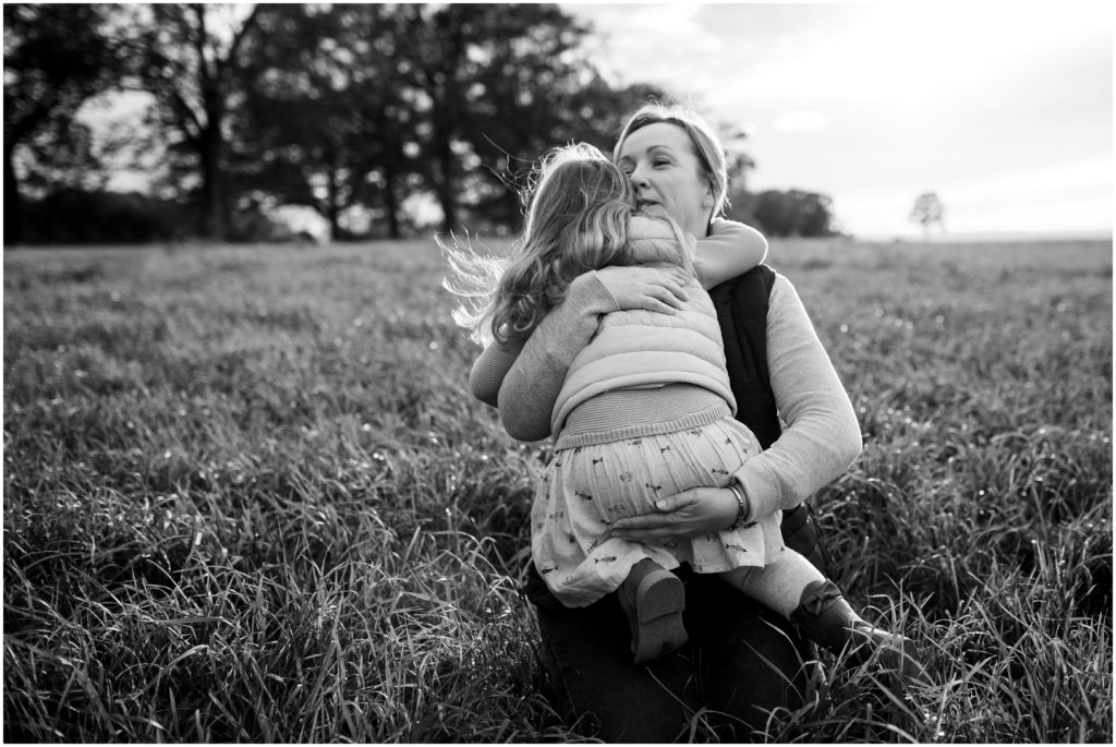 daughter-hugging-mom-in-field-boston-child-photos