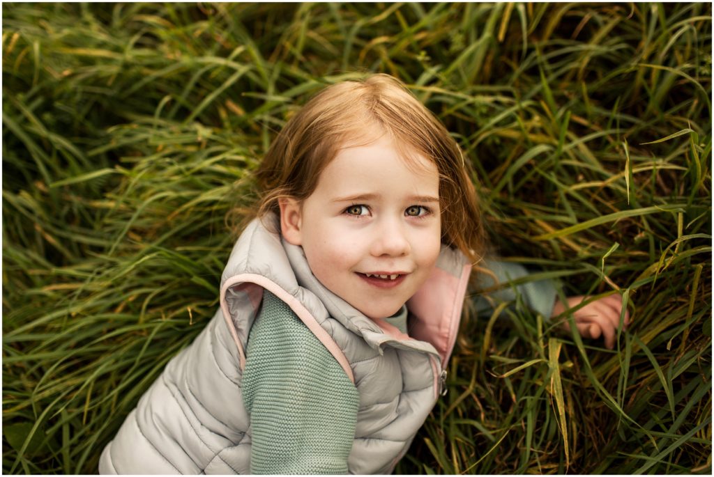 little-girl-laying-in-grass-boston-photographer