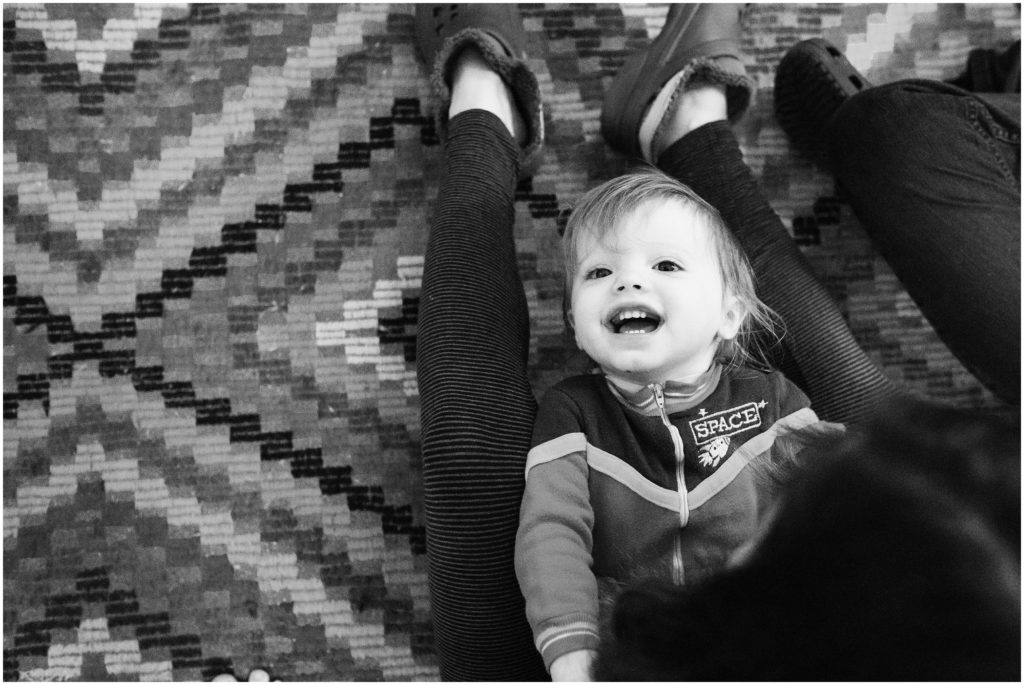 kid-laying-on-lap-boston-family-photographer