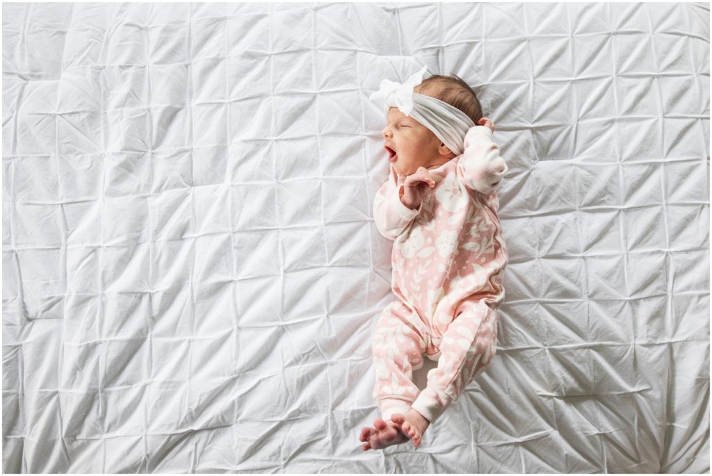 baby-girl-lying-on-bed-boston-photographer