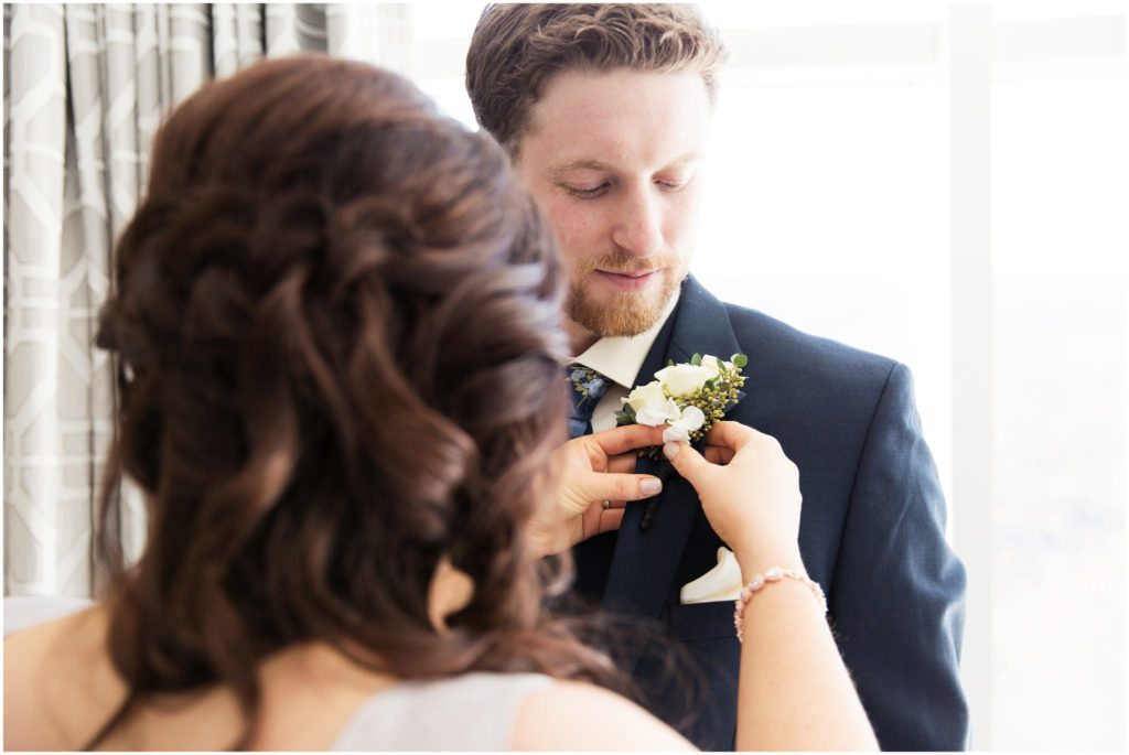 groom-getting-pinned