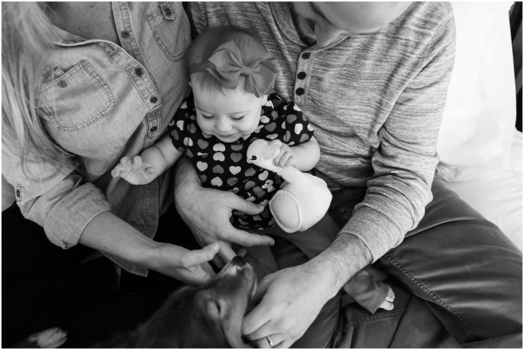 baby-in-parents-laps-framingham-photographer