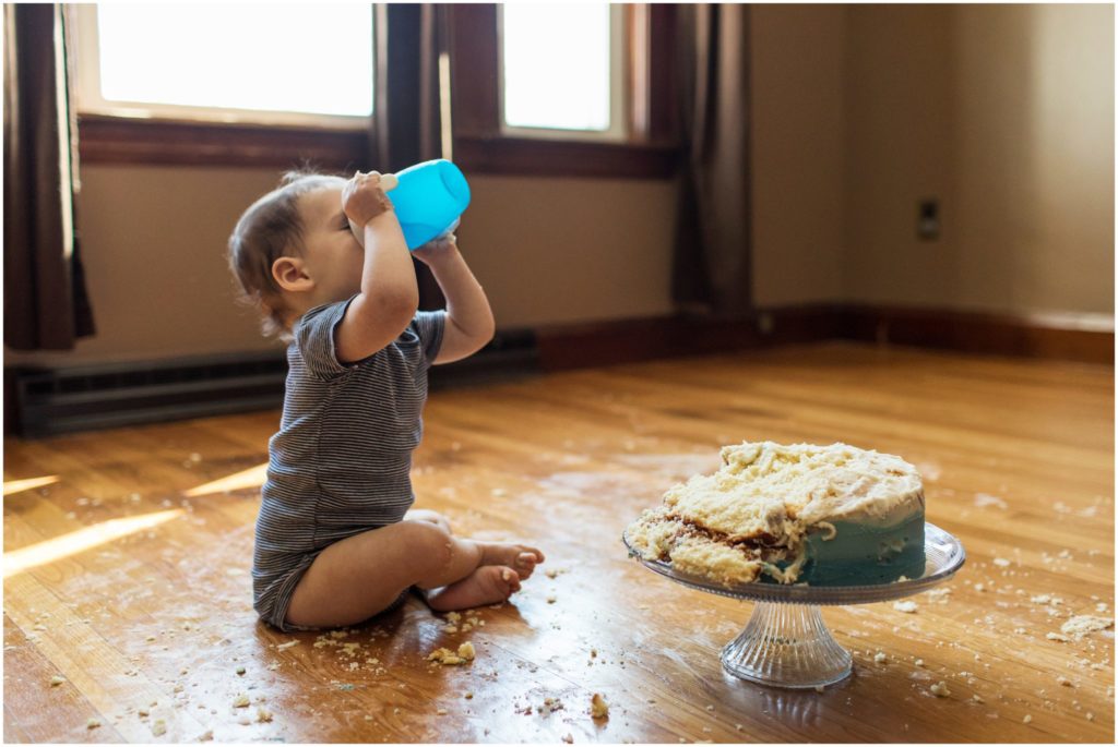 baby-taking-drink-after-cake-smash-photoshoot