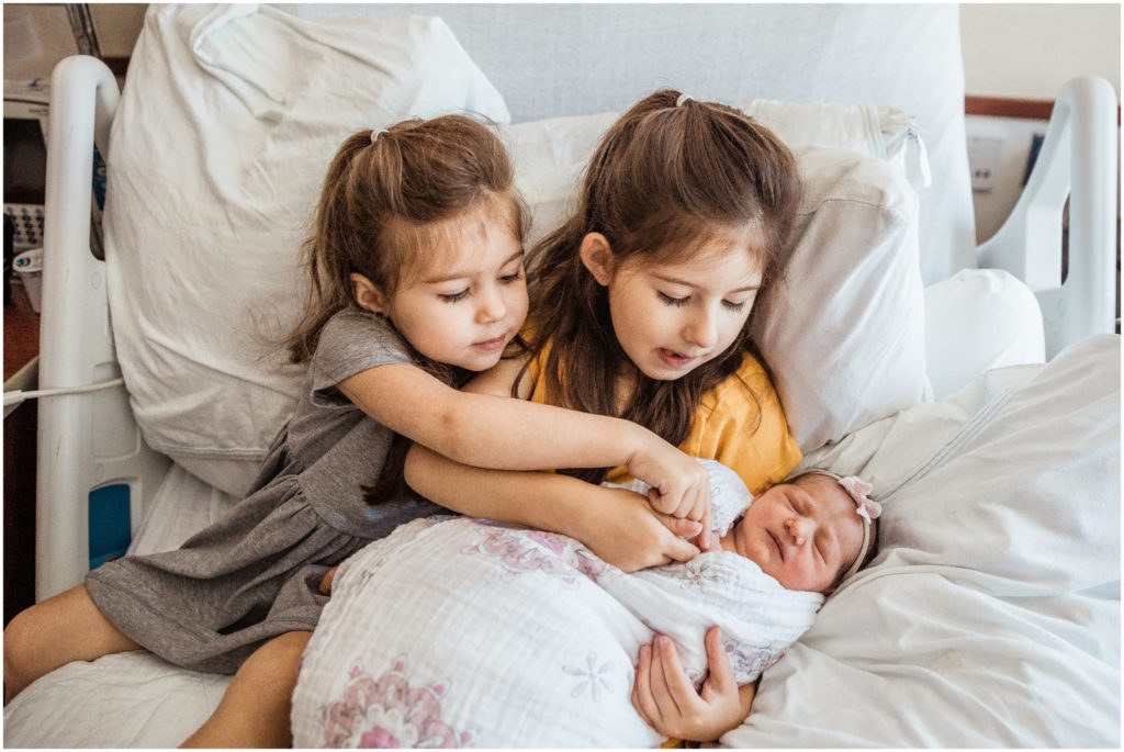 sisters-holding-newborn-boston-photographer
