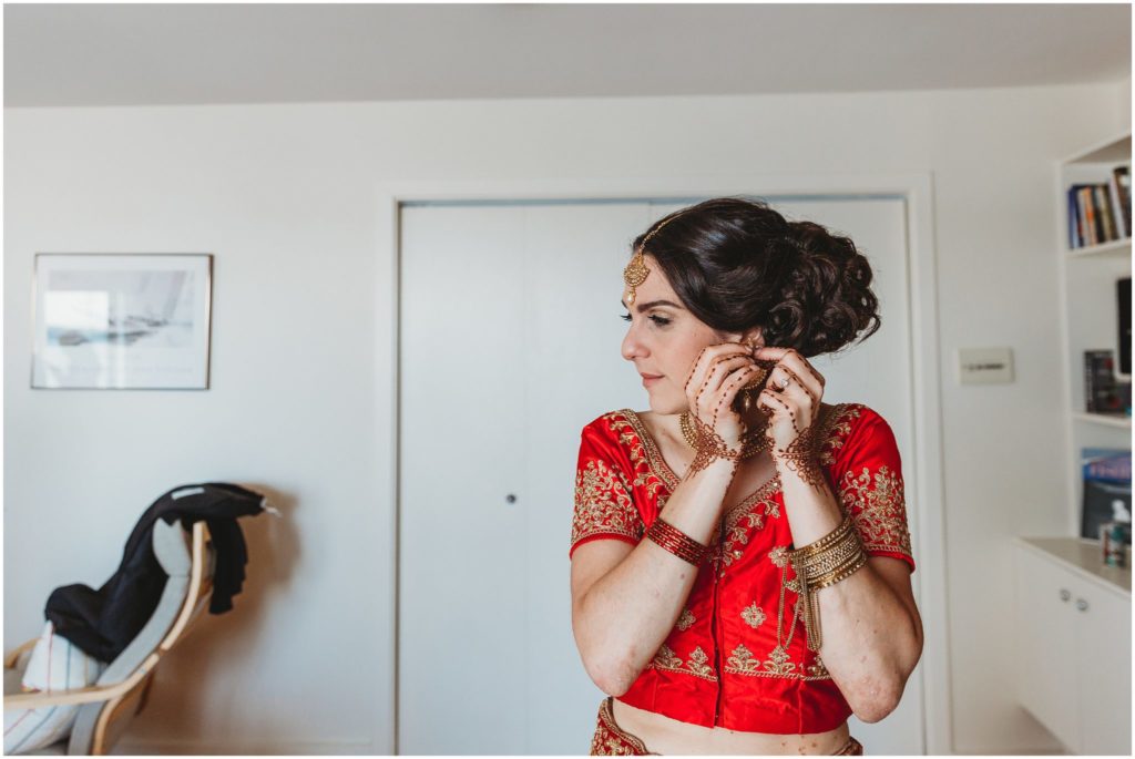 bride-putting-on-earrings-boston-wedding-photographer