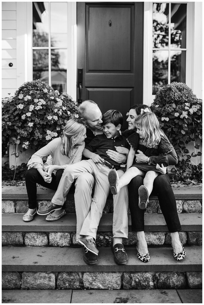 black-and-white-portrait-of-family-on-front-steps-boston-family-photographer