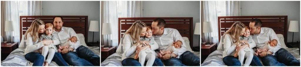 newborn-with-family-on-bed-massachusetts-photographer