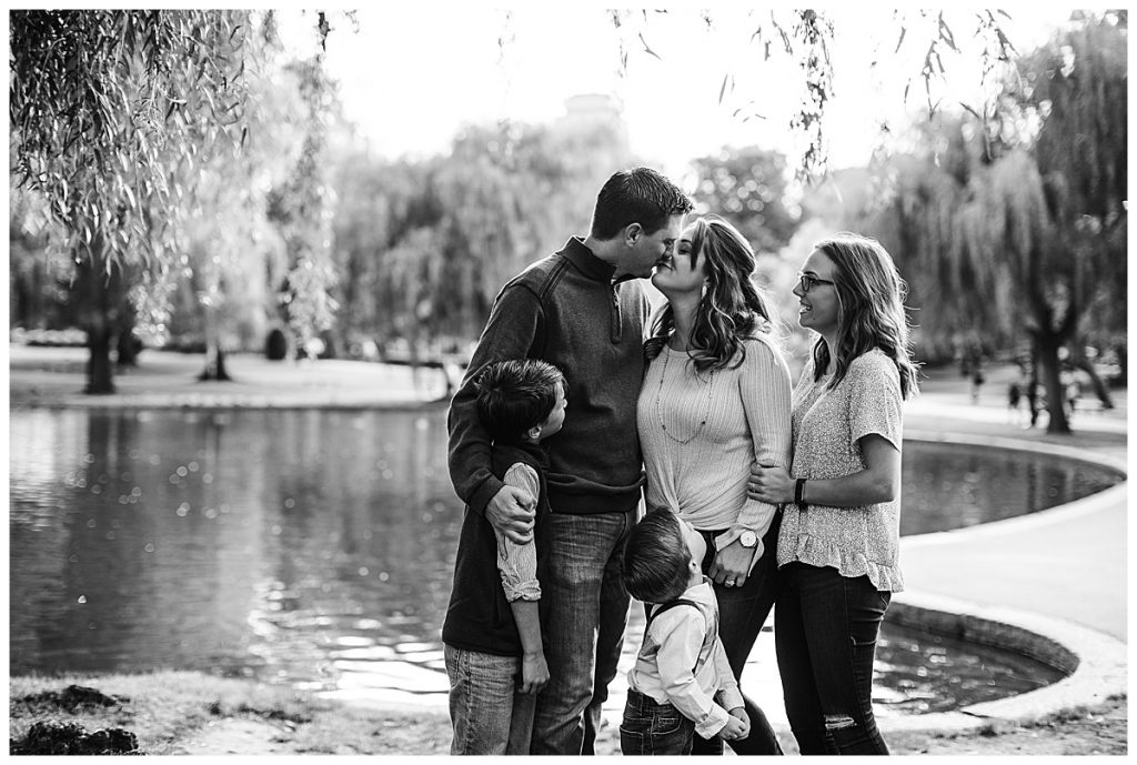 black and white portrait of a family of five standing in the Boston Public Garden