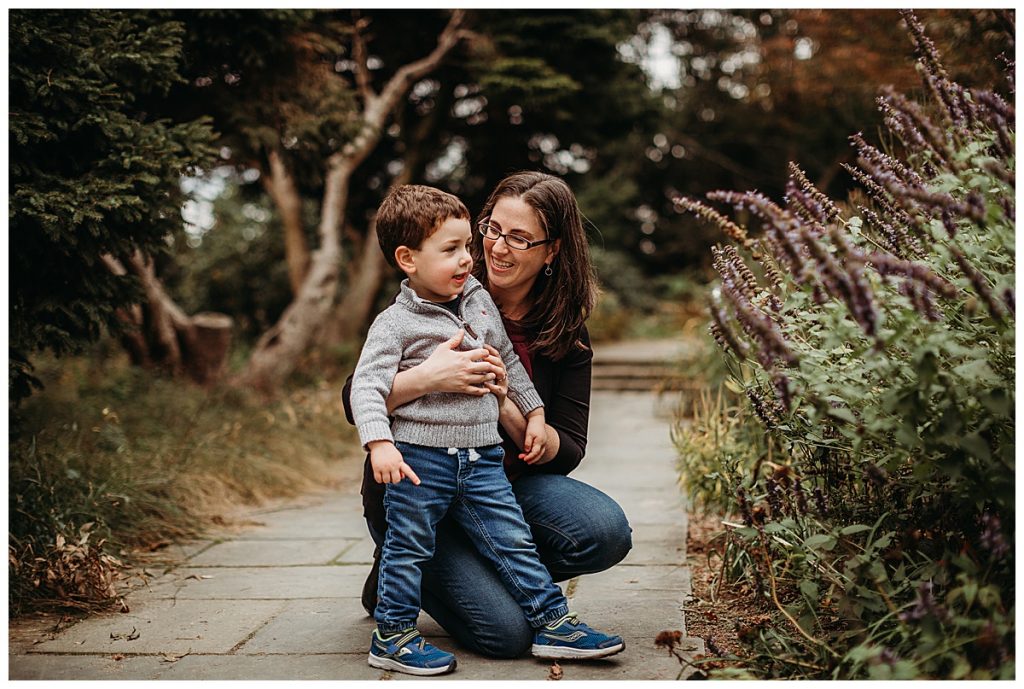 mother-hugging-toddler-son-in-garden-boston-family-photographer