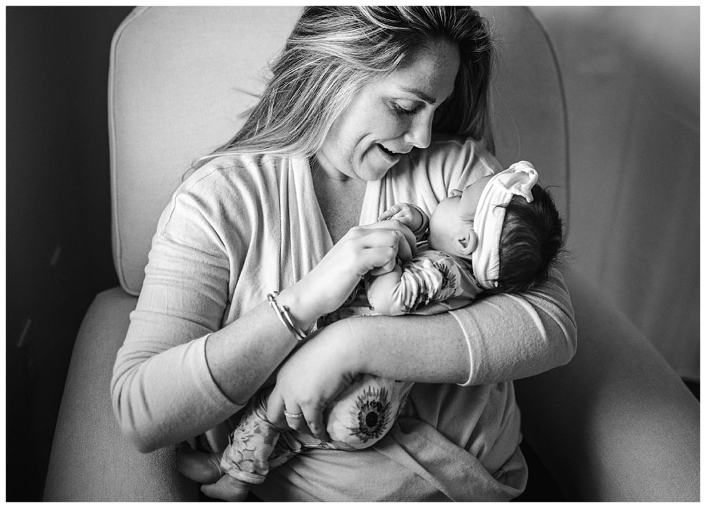 black-and-white-portrait-mother-holding-newborn-photographer-in-boston