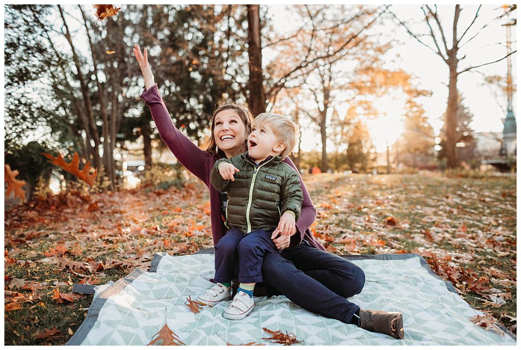 mother-throwing-leaves-in-air-boston-family-photographer
