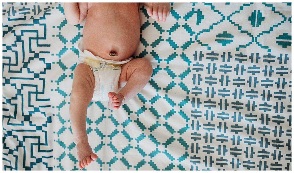 boston-newborn-photography-baby-on-printed-sheet