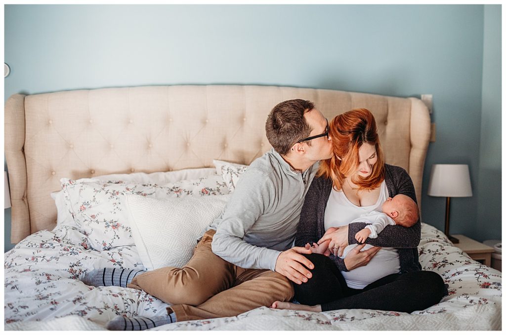 littleton-newborn-photography-baby-on-bed-with-parents