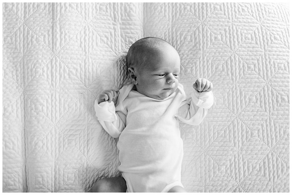 black-and-white-newborn-portrait-on-bed