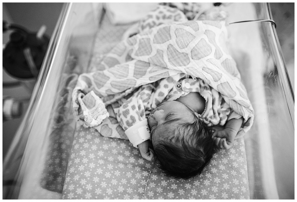 baby-girl-laying-in-hospital-bassinet-newborn-photographer-in-worcester