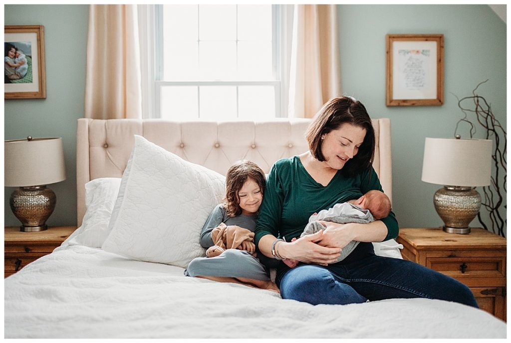 mother-and-children-nursing-on-bed-boston-newborn-photo-session