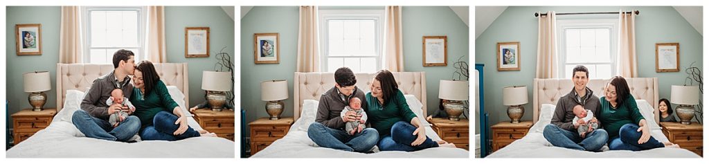 parents-holding-new-son-on-bed-boston-newborn-photography
