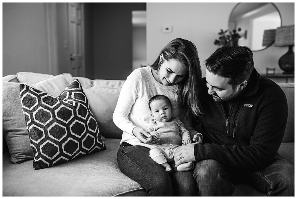 black-and-white-portrait-of-family-with-baby-boy-in-living-room-boston-ma