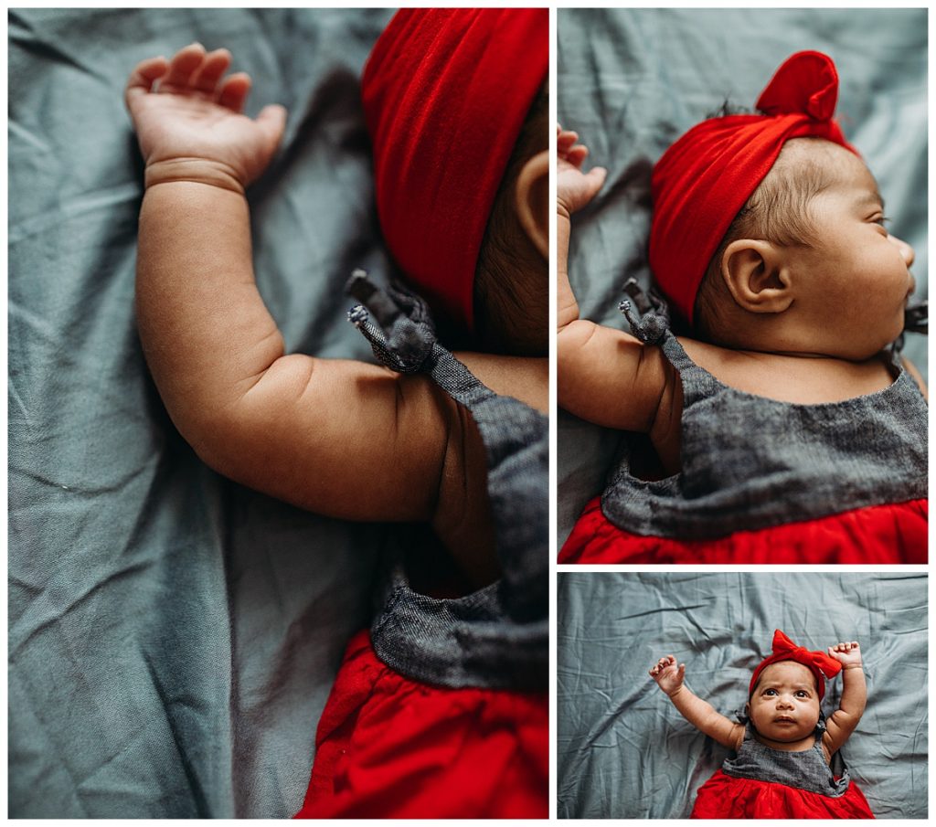 baby girl with red headband and red dress during photos