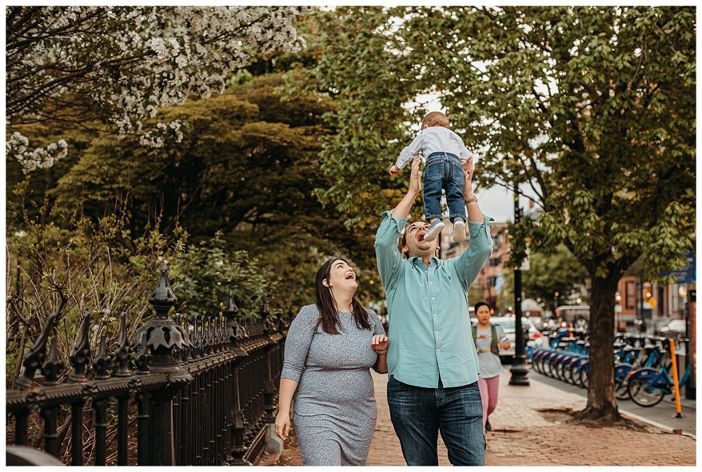 family walks down a city street in boston during photo session