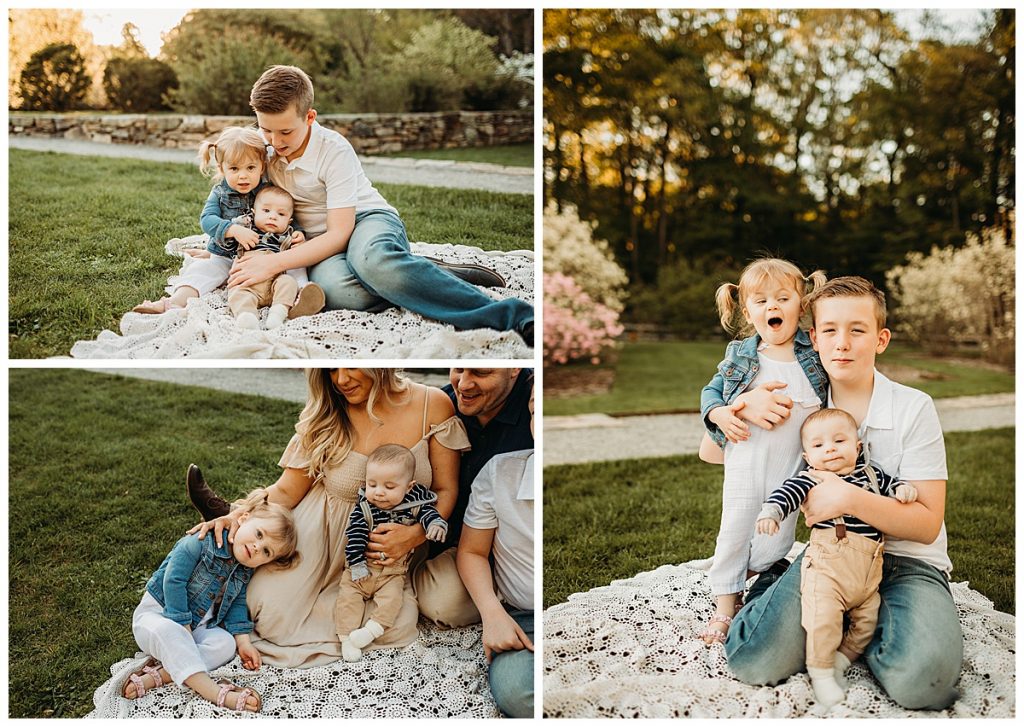 kids snuggle on lace blanket on the grass during family pics