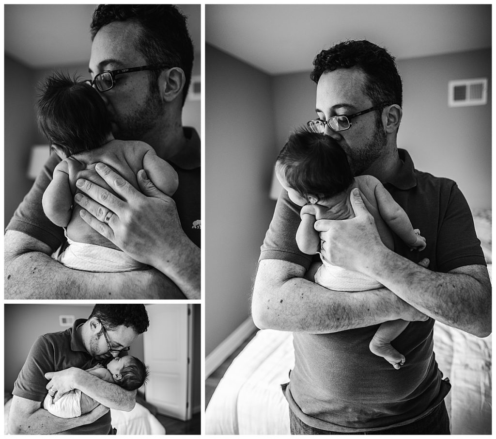 black and white portrait of father with newborn baby in diaper