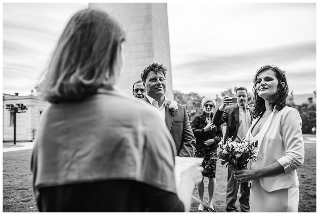 black and white image of wedding ceremony by bunker hill monument