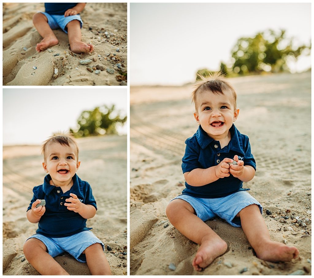 one year old boy in blue shorts sits on beach for first birthday portraits