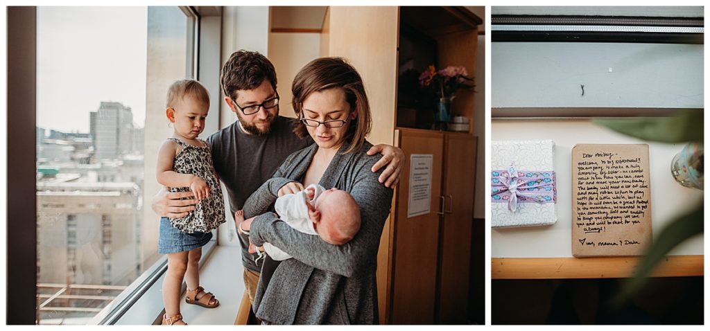family of four admire new baby boy by hospital window in boston mass