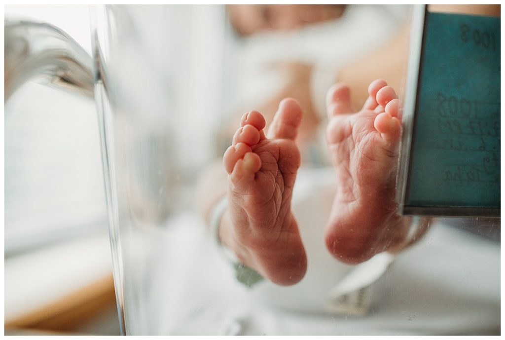 baby feet lying in a hospital bassinet during newborn photographs