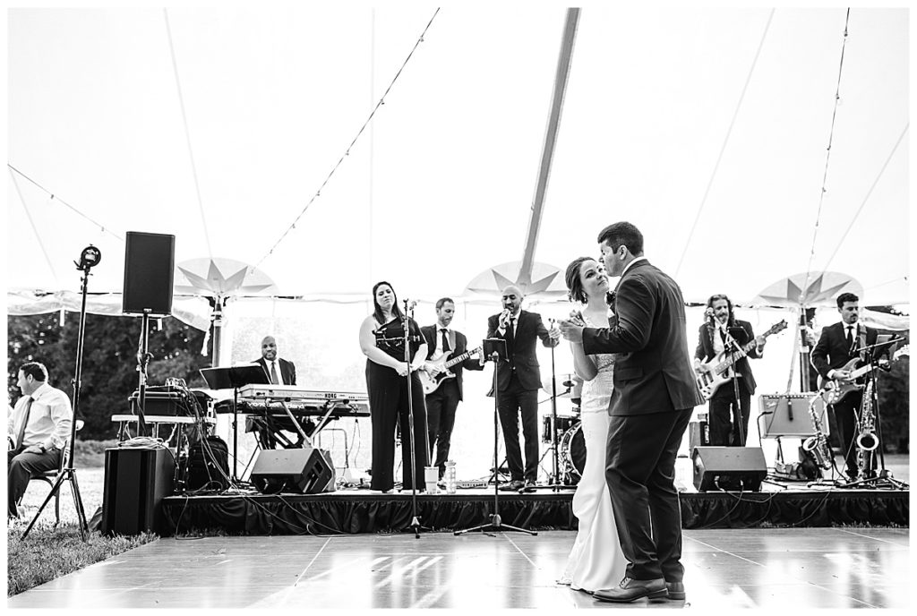 first dance for bride and groom in tented reception