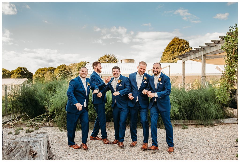 groomsmen hanging out for portraits