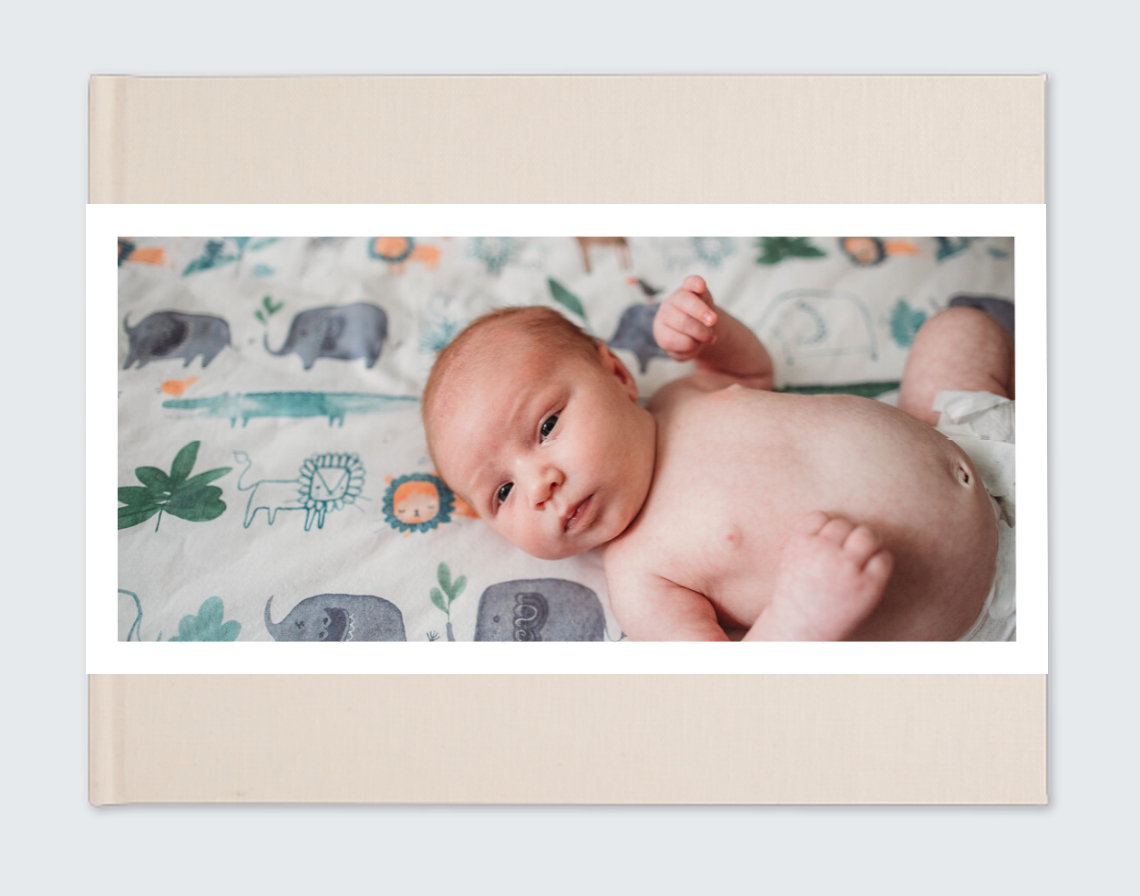 newborn album with photo on front cover