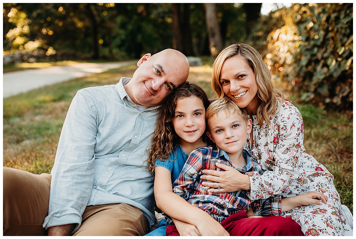 family of four takes family portraits in boston