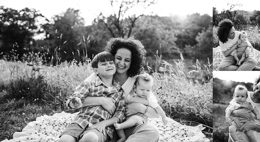 black and white image of mother with sons outdoors