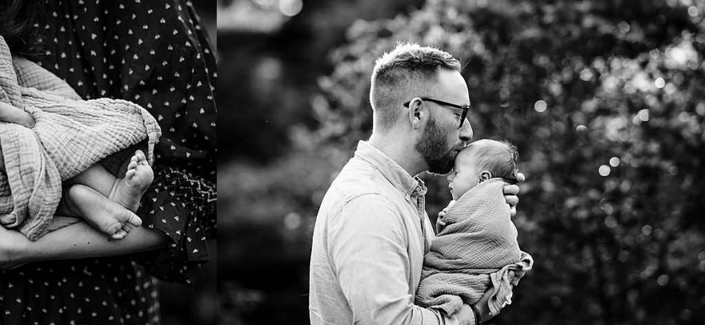 black and white portrait of dad kissing babys head