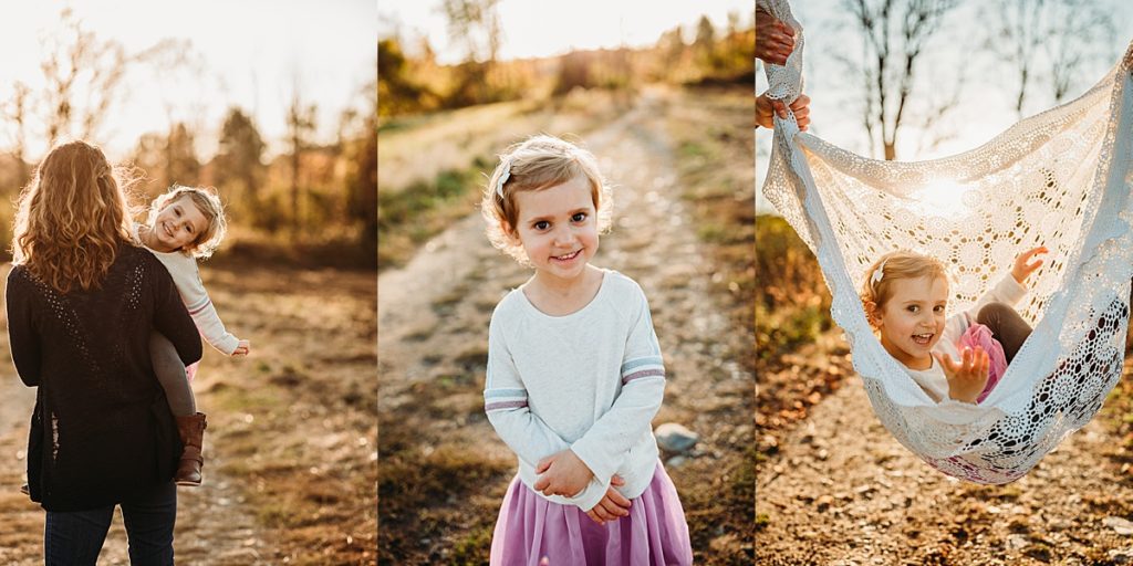 toddler girl cheeses for camera during family pics