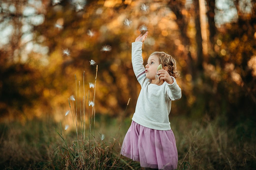 little girl in Autumn during photo session with boston family photographer