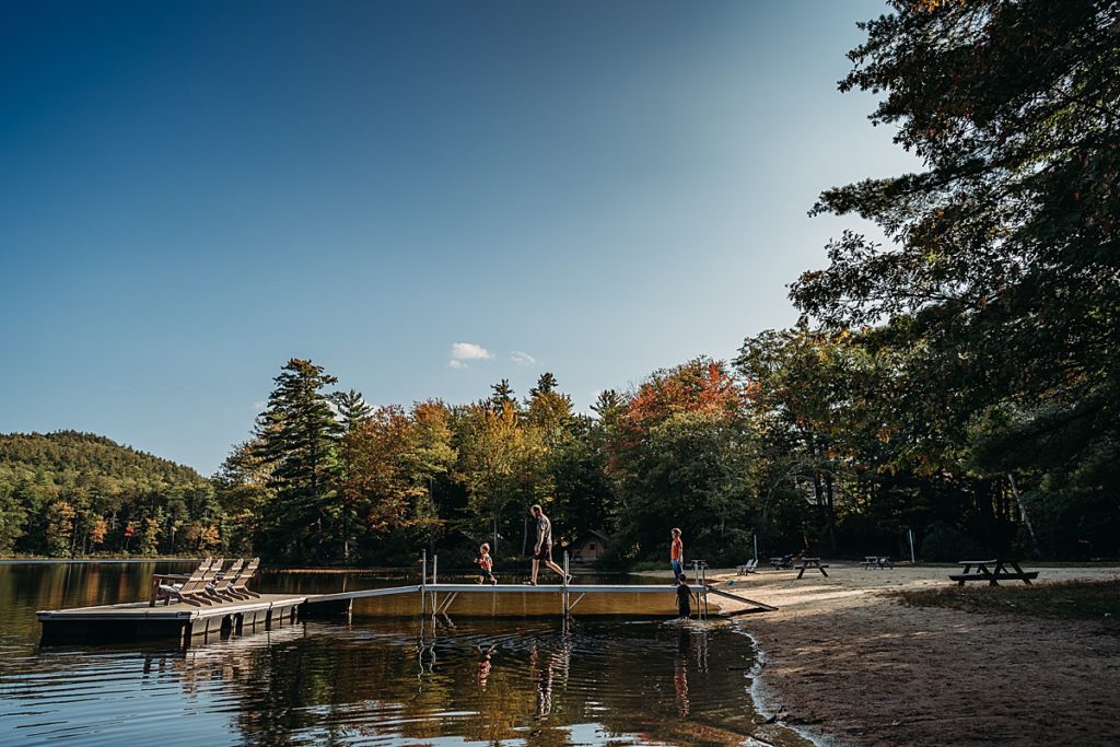 kids walking on a dock in new hampshire